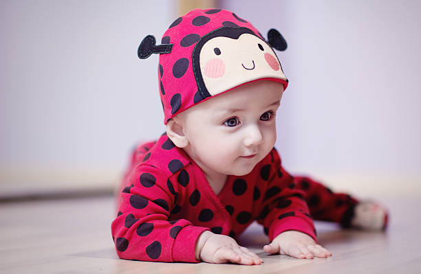 Bébé de 9 mois déguisé en coccinelle 